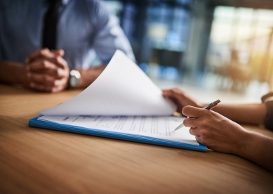 People at table looking through documents